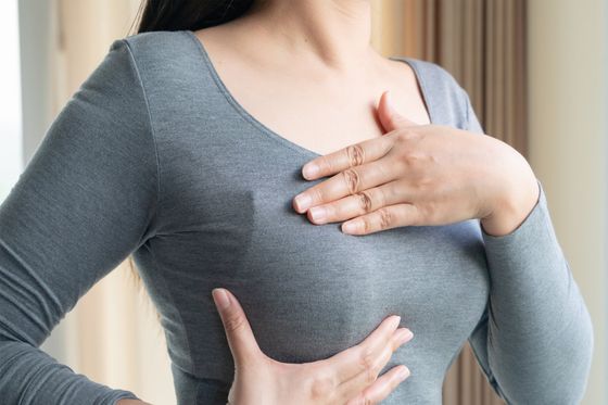 Young Woman Checking Lumps On Her Breast — St Michael, BB — Pro Med Inc. Young Woman Checking Lumps On Her Breast — St Michael, BB — Pro Med Inc.