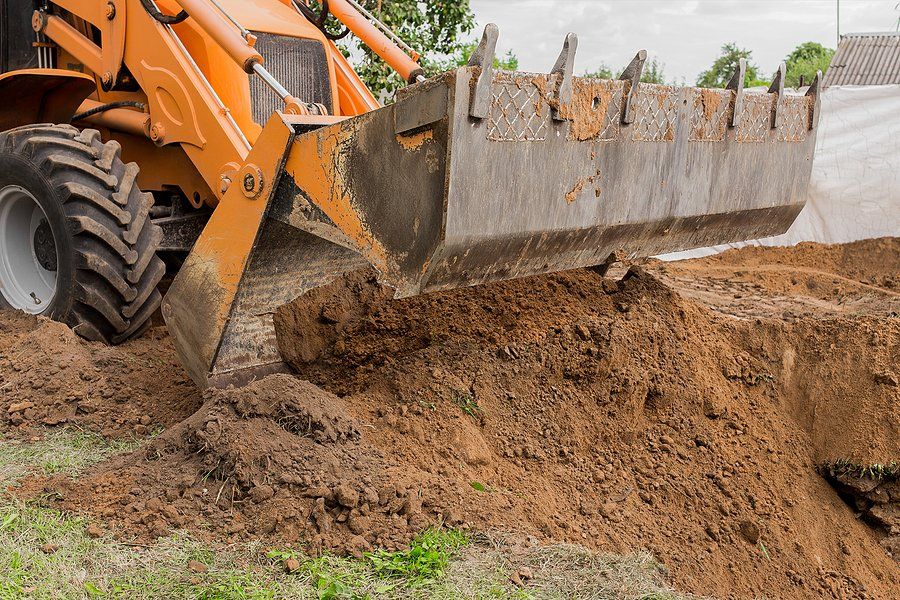 a truck grading ground
