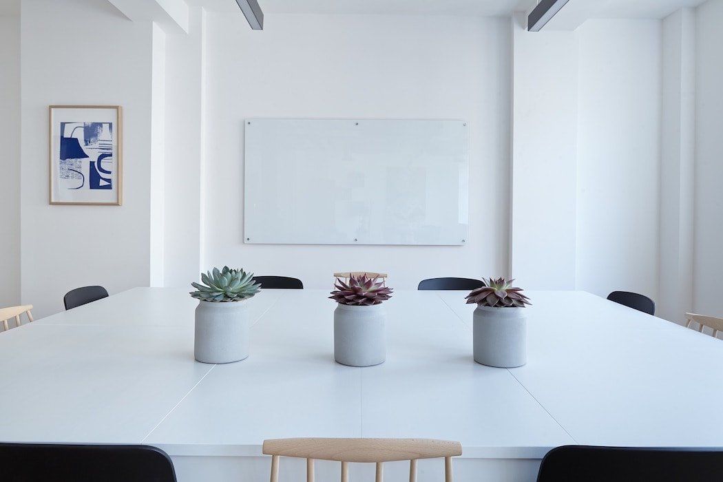 Photo of a crisp white kitchen and living room area