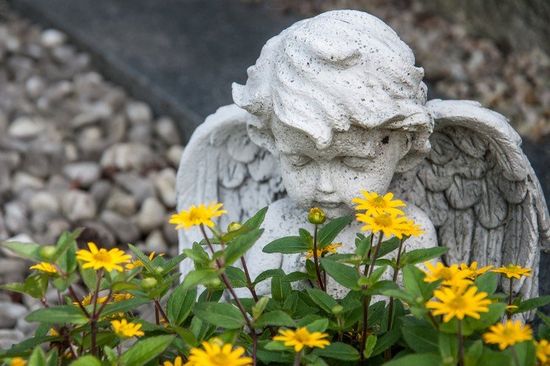 Angel And Yellow Flowers On A Grave — Columbus, GA — Columbus Monument Company Angel And Yellow Flowers On A Grave — Columbus, GA — Columbus Monument Company