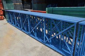 Blue Painted Rack Outside a Warehouse — Warehouse Installation Dallas, TX Blue Painted Rack Outside a Warehouse — Warehouse Installation Dallas, TX