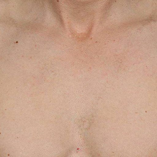 A close up of a woman 's chest and neck.