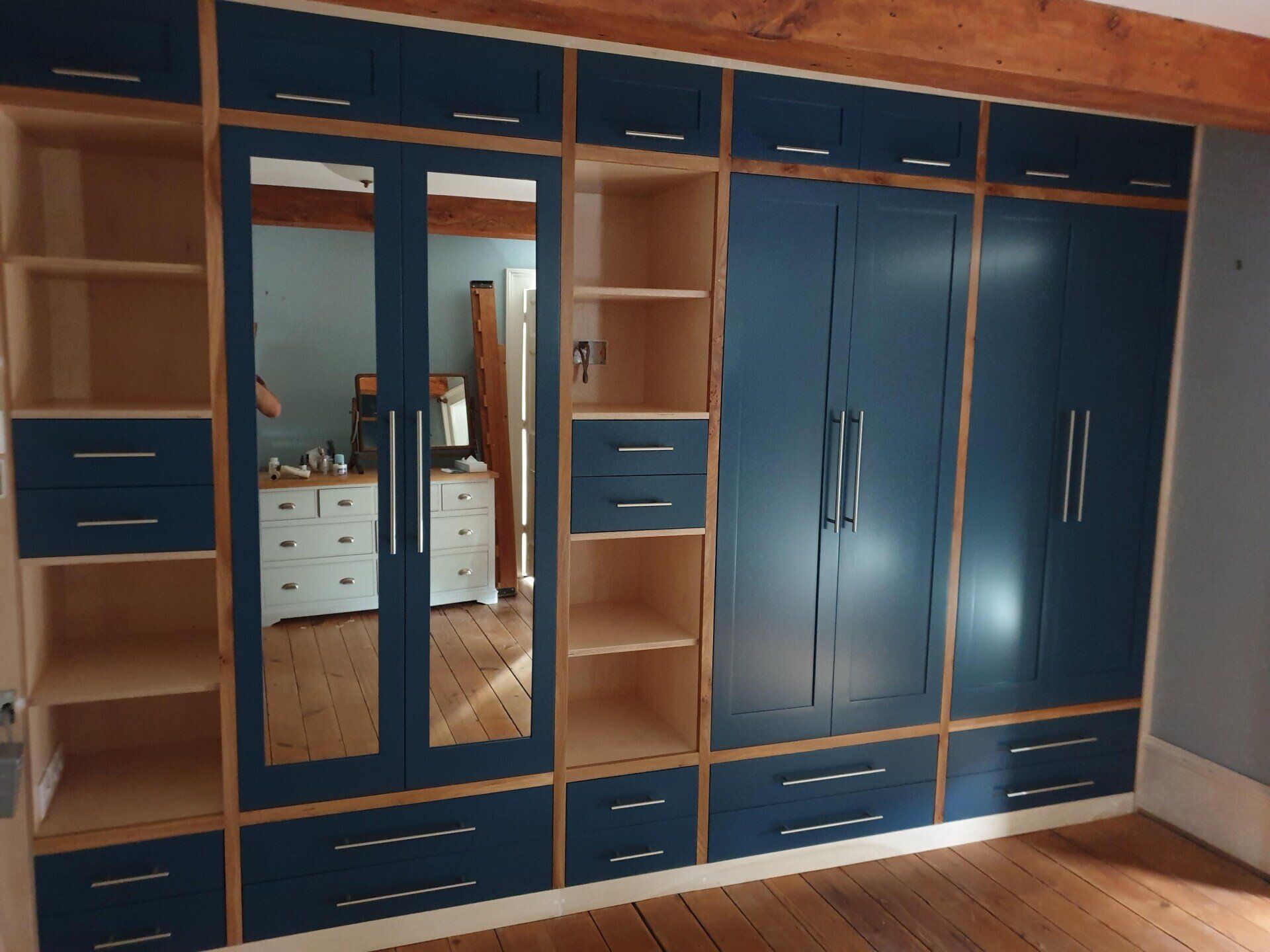 Bespoke wardrobe
mirrored doors
wooden drawers
birch plywood 
elm 