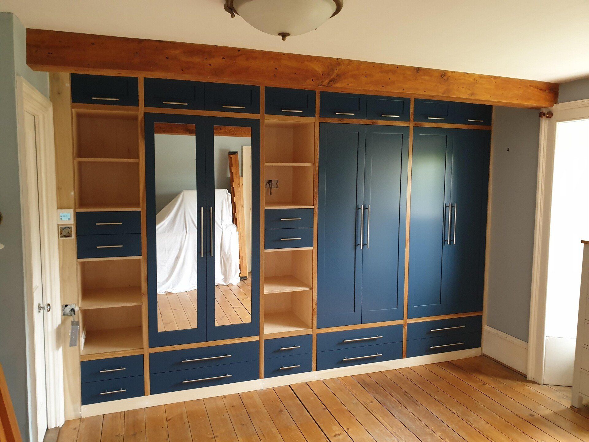 Bespoke wardrobe
mirrored doors
wooden drawers
birch plywood 
elm 
