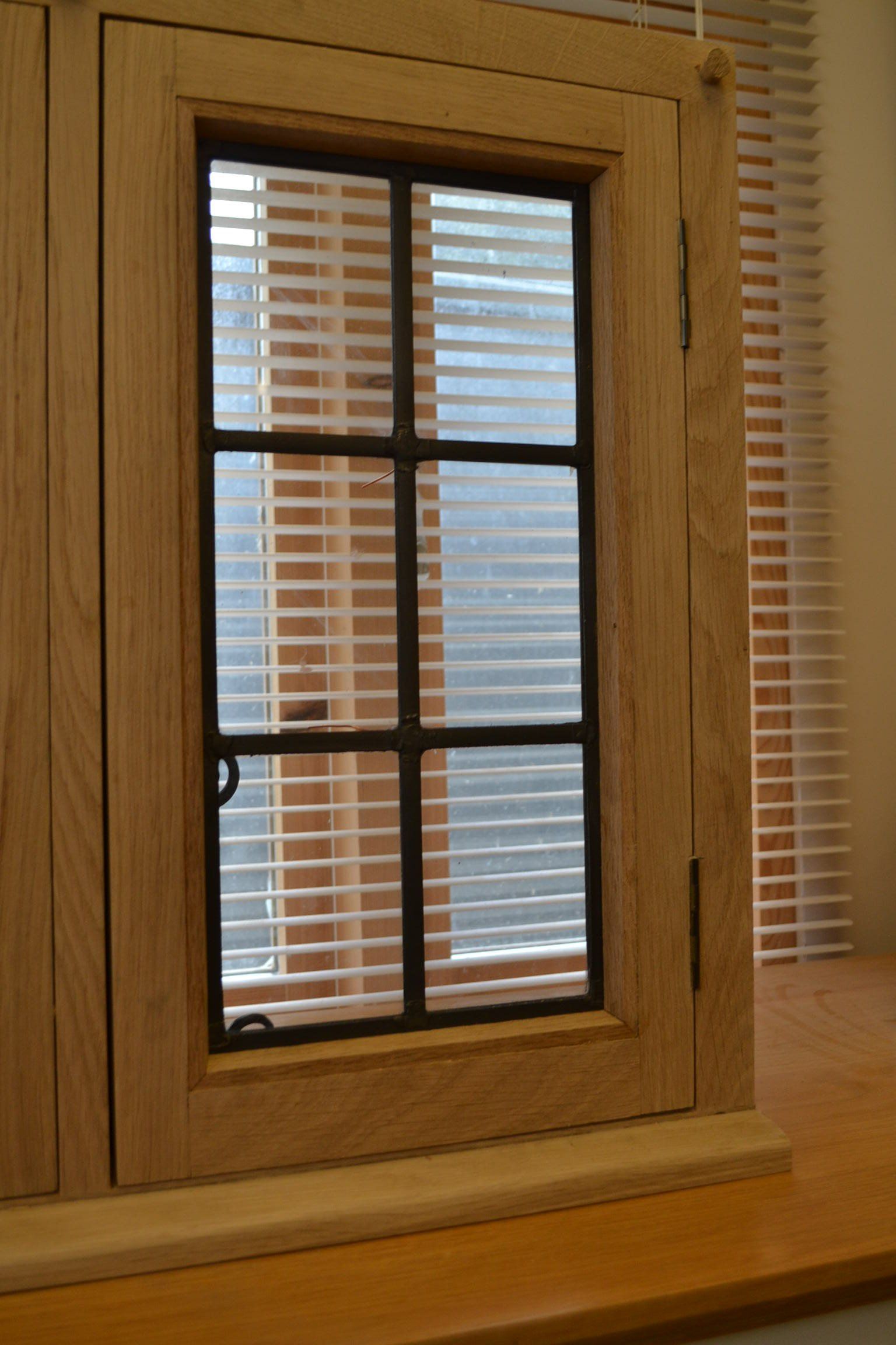 Oak leaded window
traditional leaded glass window
black handle