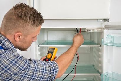 Equipment — Man Working At The Fridge in Roslindale, MA