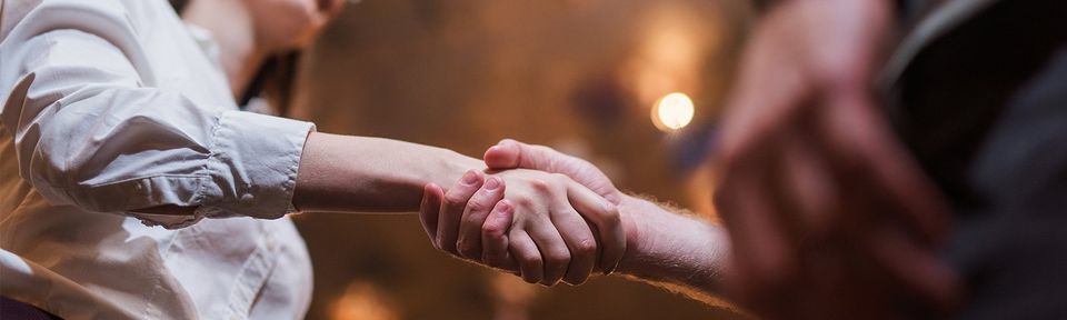 A woman and man shakes hands