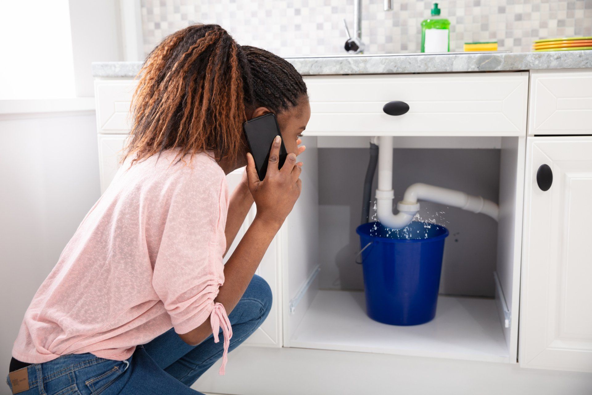 Plumber Fixing Sink Pipe — Brunswick, GA — Rooter Express Plumbing & Drain Plumber Fixing Sink Pipe — Brunswick, GA — Rooter Express Plumbing & Drain
