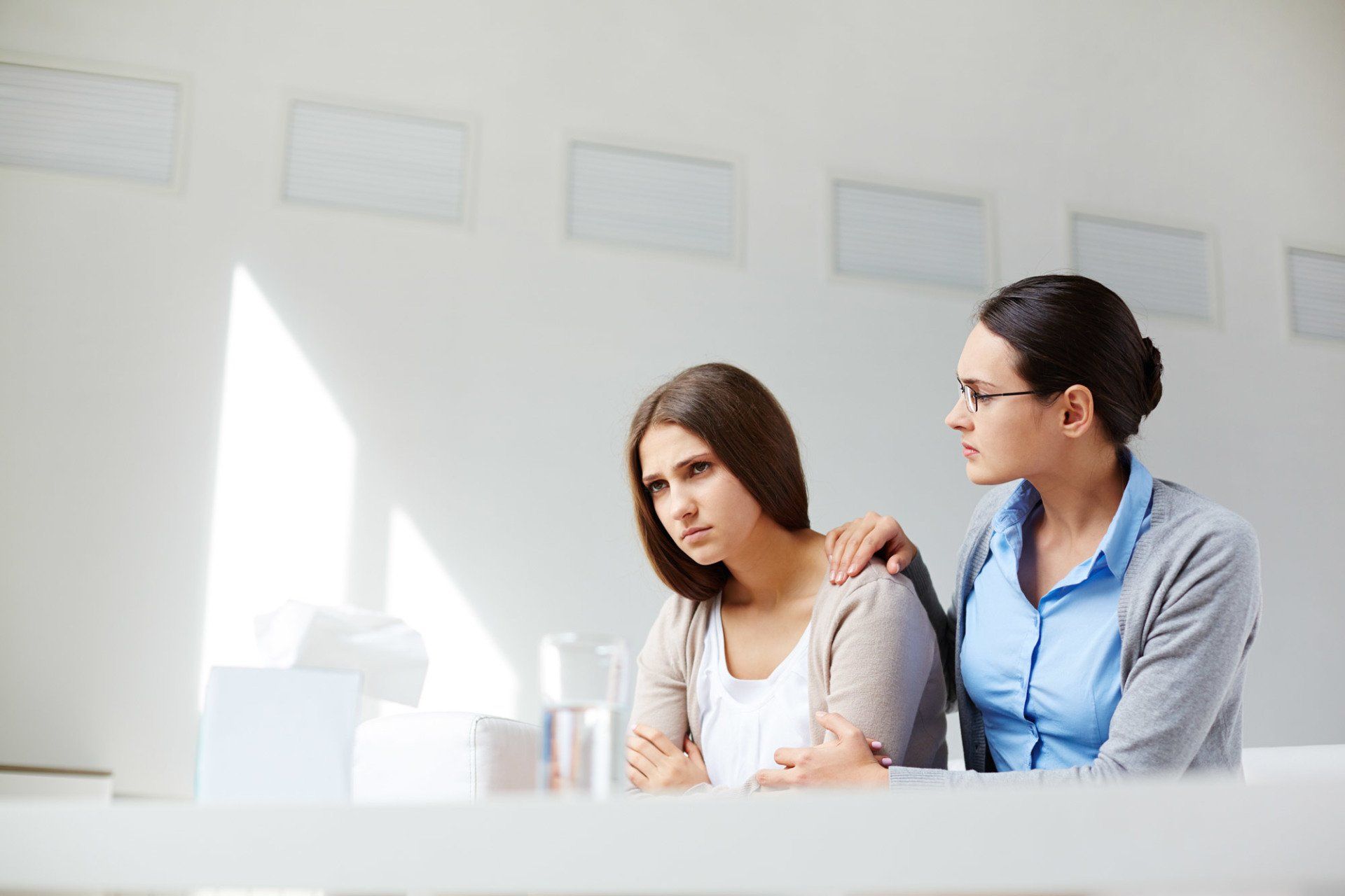Young woman in consultation with a boy