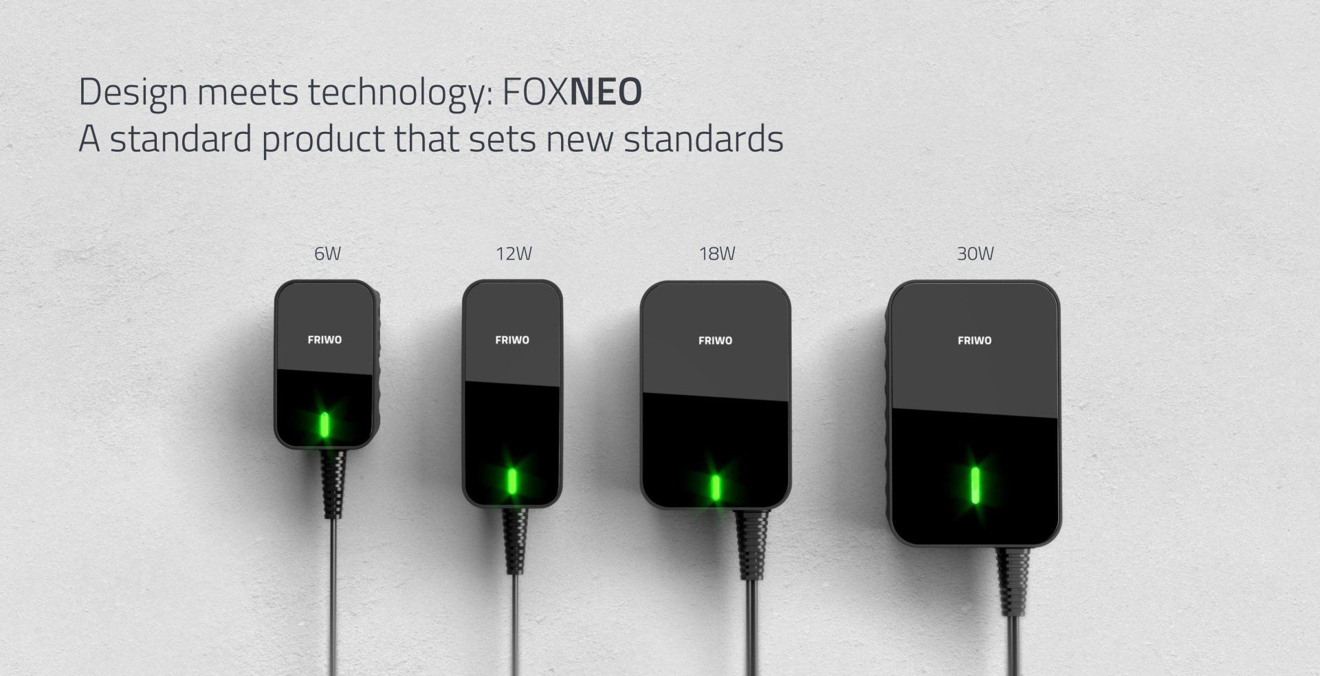 Four power supplies are lined up next to each other on a wall ..