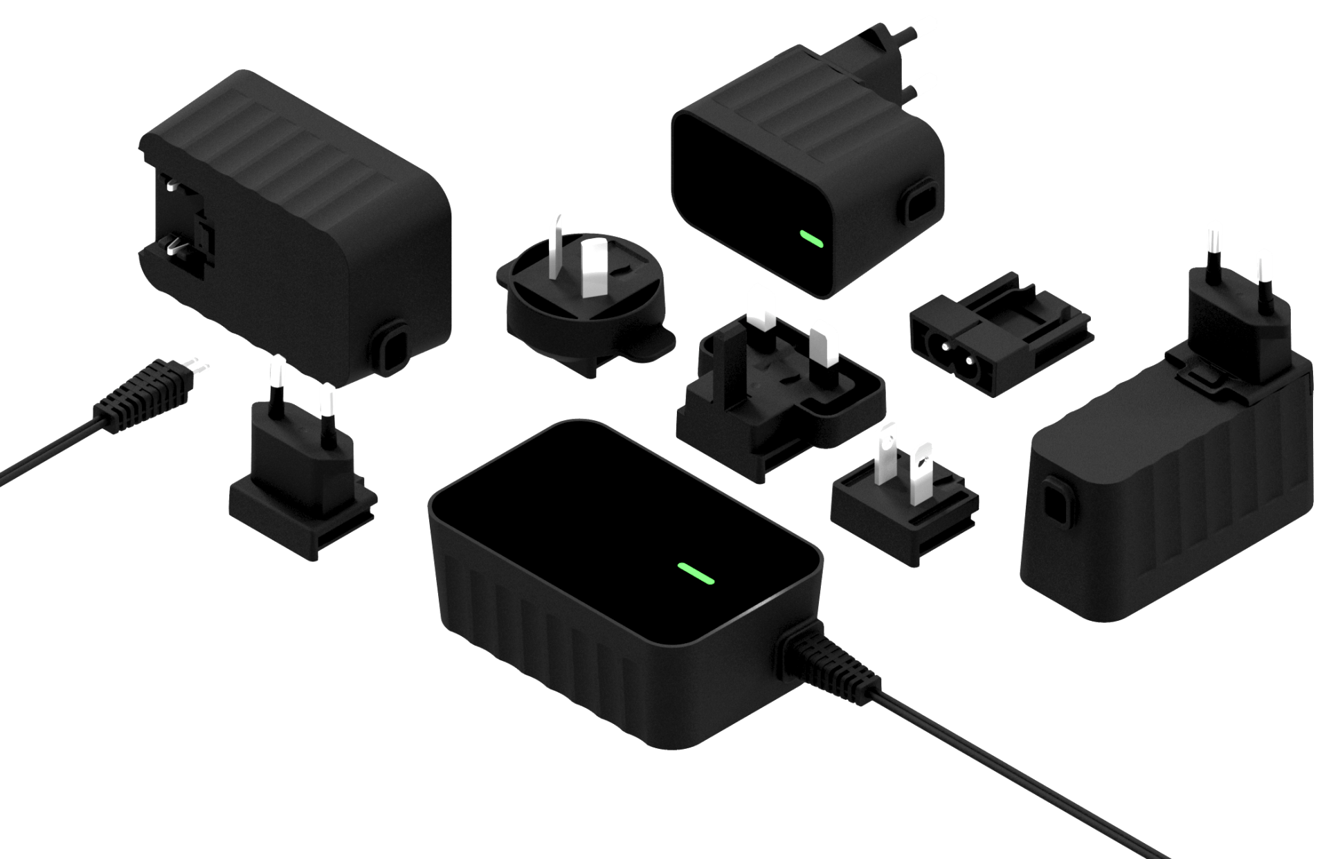 A bunch of power supplies are sitting near each other with cables and plugs on a white background.