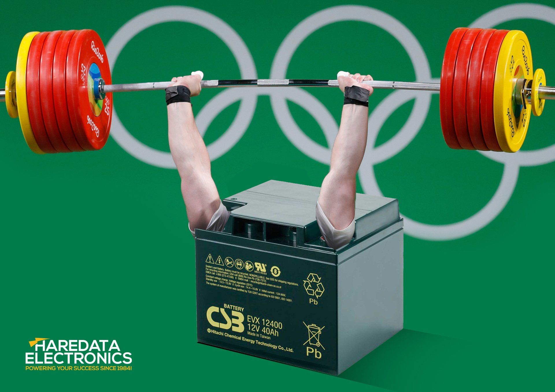 A man is lifting a barbell over a c3 battery
