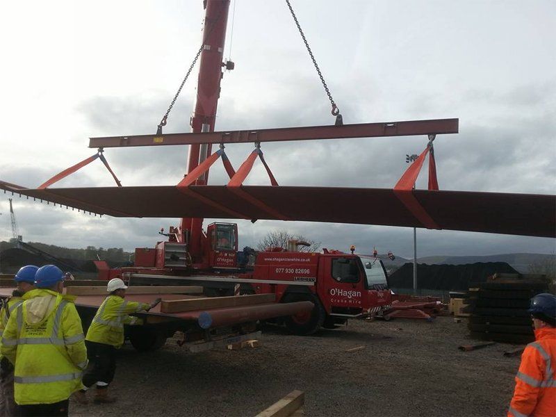 Crane lifting metal object