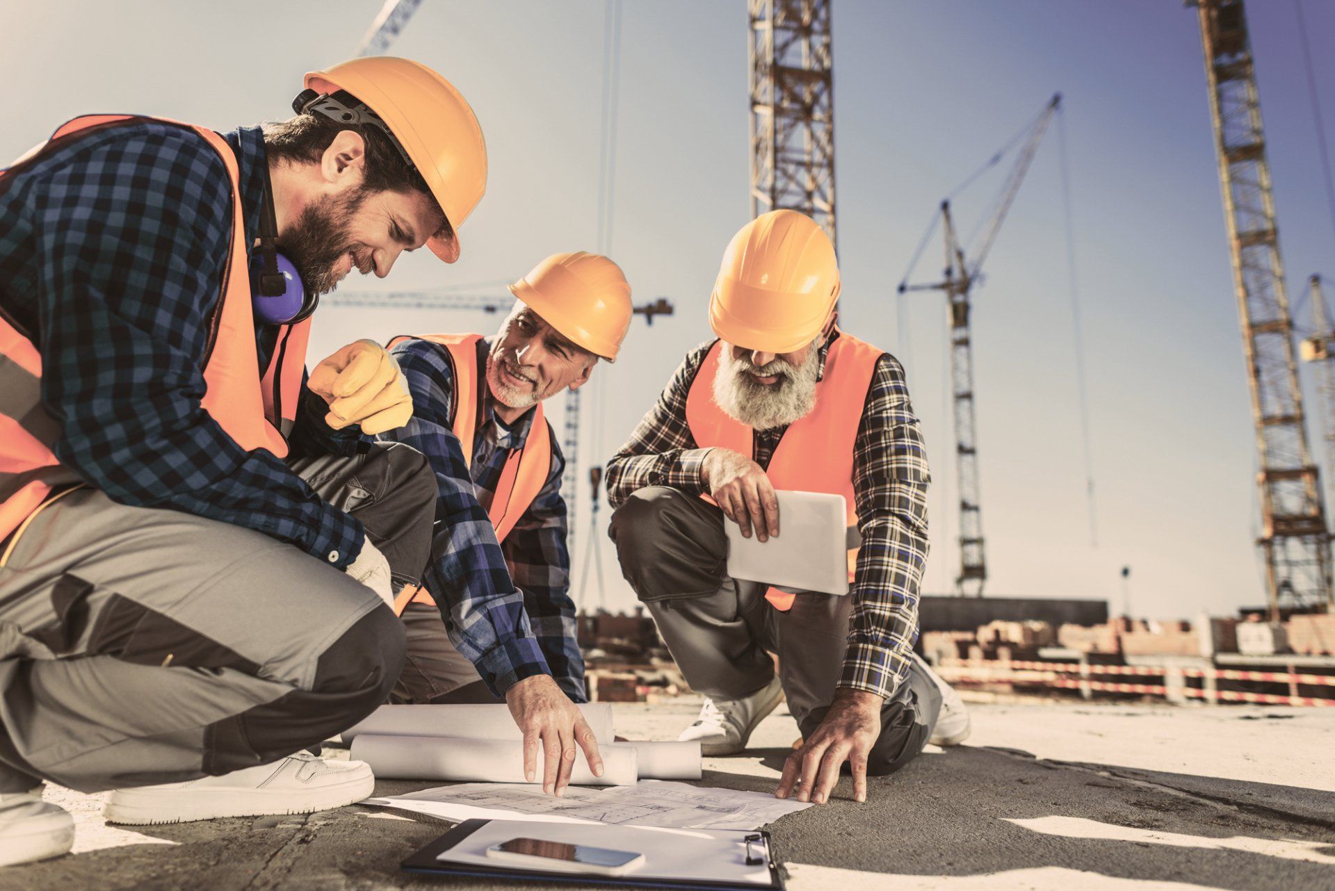Men working on a parking lot repaving project in Toronto, ON