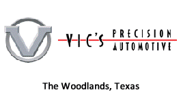 A logo for vic 's precision automotive in the woodlands , texas