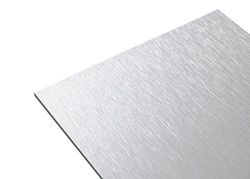 A close up of a piece of stainless steel on a white background.