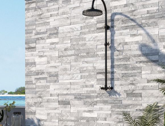 Natural Stone Feature Wall with Outdoor Shower — Tile Supplies in Alstonville in Alstonville, NSW Natural Stone Feature Wall with Outdoor Shower — Tile Supplies in Alstonville in Alstonville, NSW