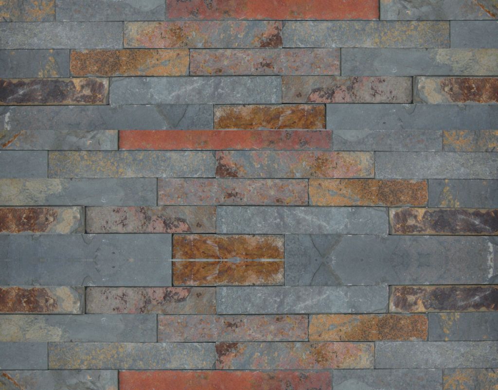 Mehrfarbige Backsteinmauer mit horizontalen rechteckigen Steinen in Grau-, Orange- und Brauntönen.