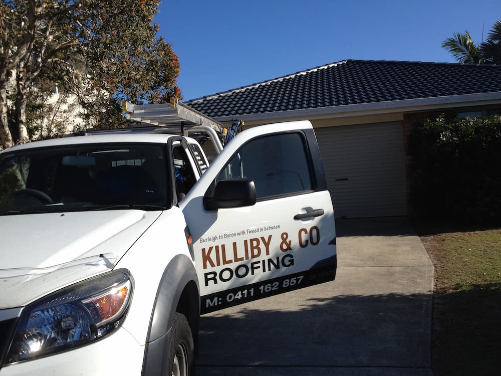 Killiby Service Vehicle, Garage Door In Background — Roof & Gutter Repairs in Gold Coast, QLD