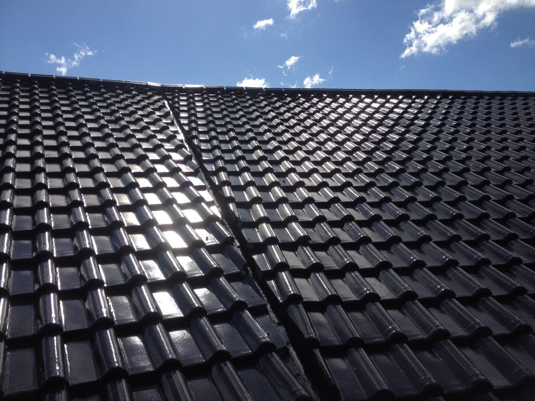 Shiny Black Roof — Killiby & Co Roofing Pty Ltd in Tweed, NSW