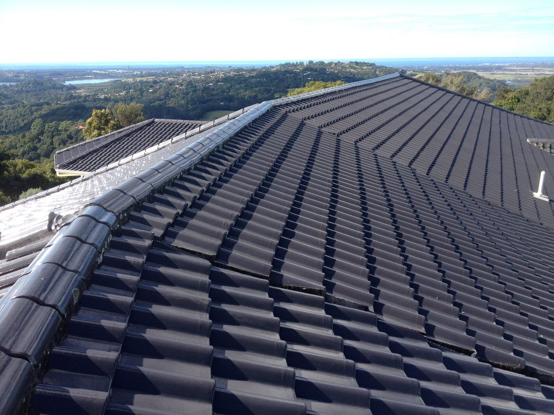 The Roof of a House With a View of the Ocean and Mountains — Killiby & Co Roofing Pty Ltd in Tweed, NSW