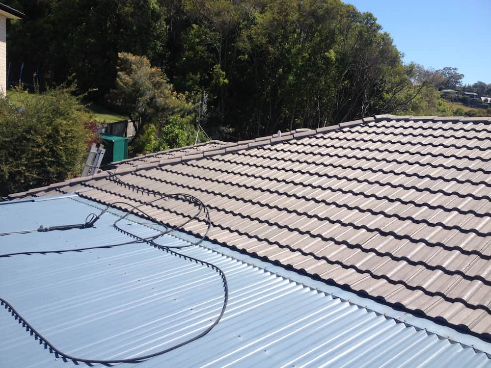 A Roof With a Lot of Tiles and Trees in the Background — Killiby & Co Roofing Pty Ltd in Tweed, NSW