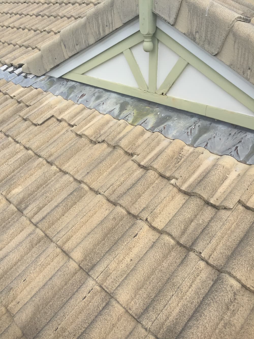 A Close Up of a Tiled Roof With a Green Trim — Killiby & Co Roofing Pty Ltd in Tweed, NSW
