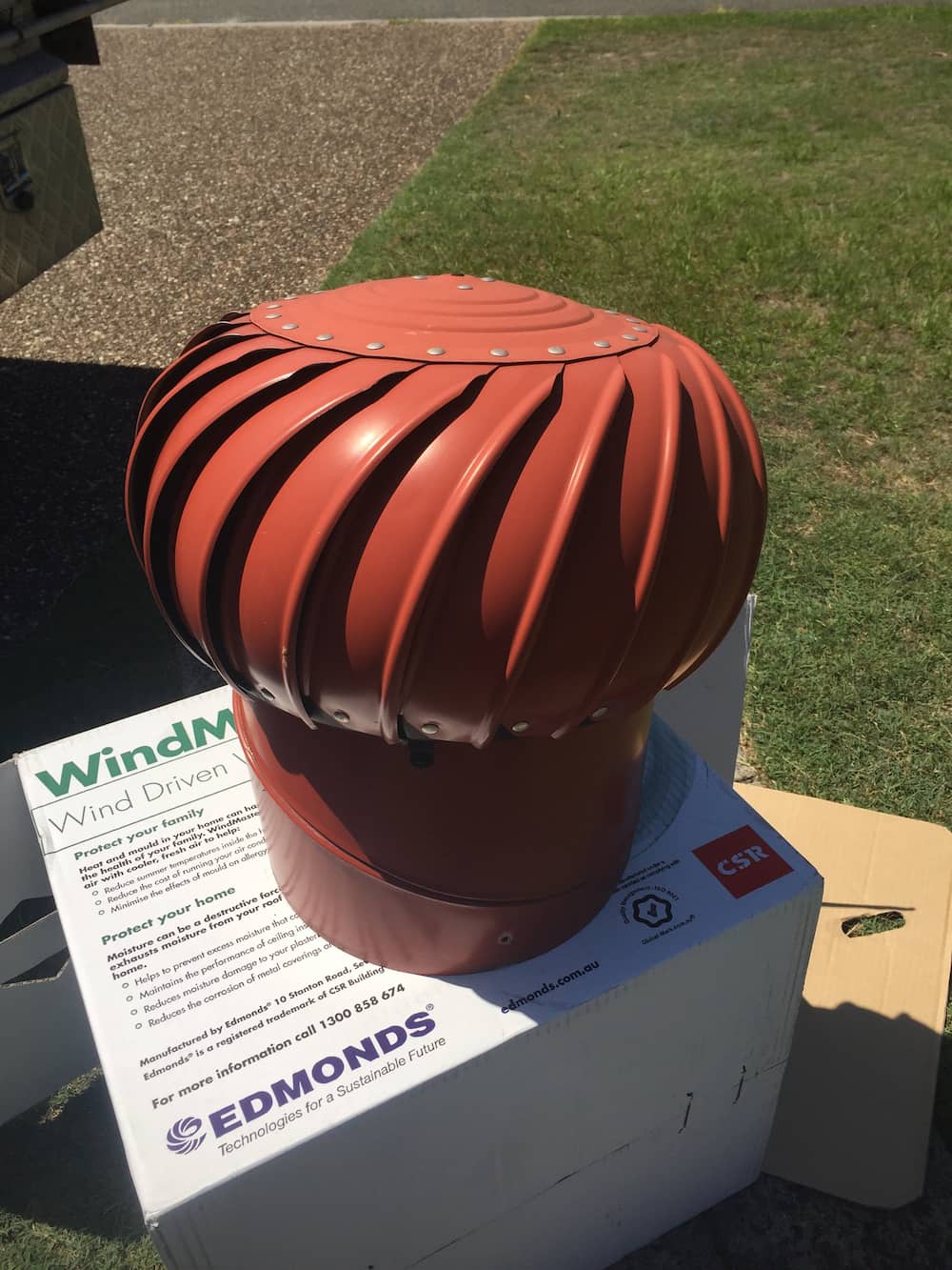New Red Whirlybird Ready For Installation — Roof & Gutter Repairs in Tweed Heads, NSW