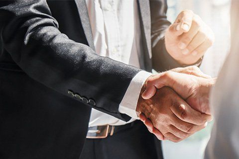 Attorney Shaking Hands with Client — Chiefland, FL — Smith Law Firm A criminal defense attorney ready to serve Gainesville, FL