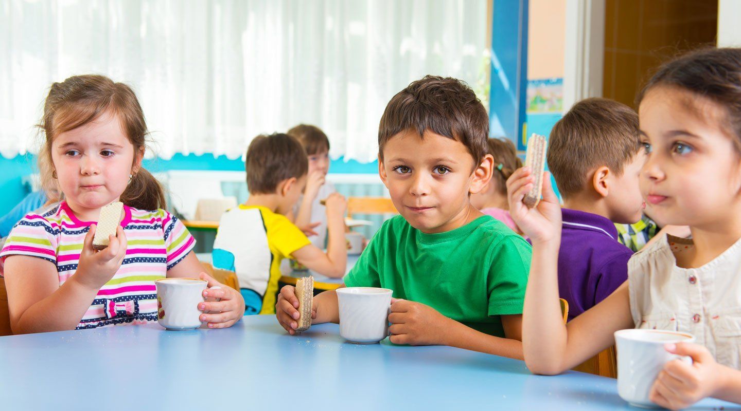 Young kids eating snacks