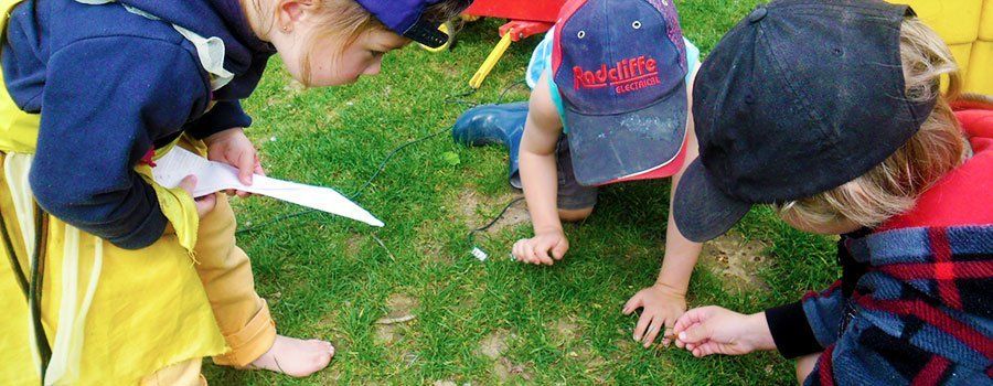 young kids playing in field
