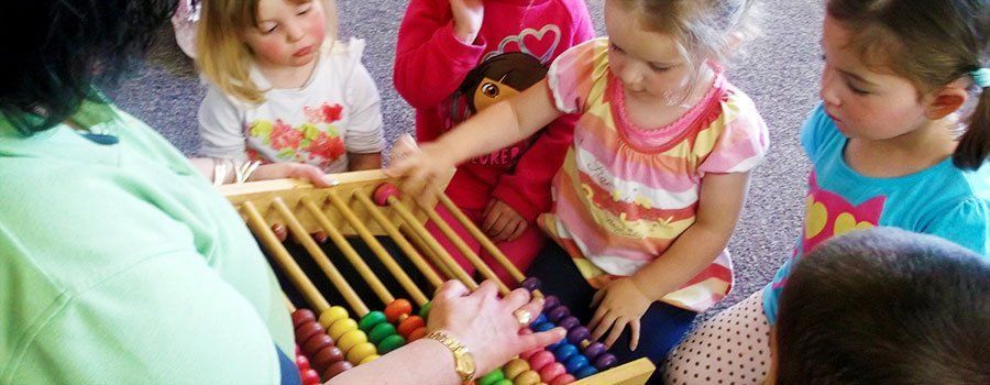 Children playing with toys in class