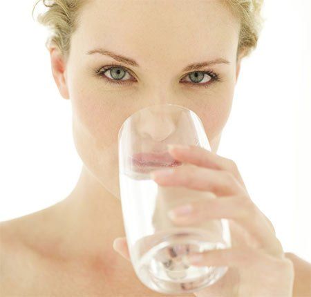 Woman Drinking Water — Fresno, CA — Art Douglas Plumbing Inc. Woman Drinking Water — Fresno, CA — Art Douglas Plumbing Inc.