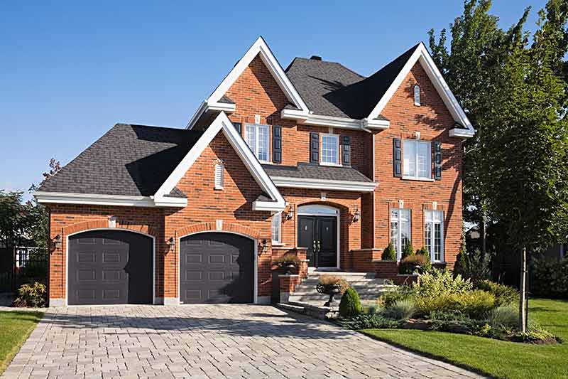 Big House with Brick Wall — Fresno, CA — Art Douglas Plumbing Inc.