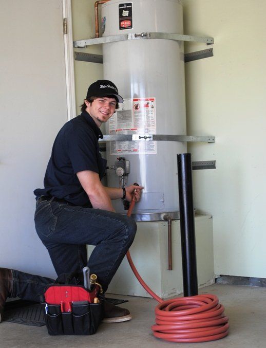 Draining Water Tank — Fresno, CA — Art Douglas Plumbing Inc. Draining Water Tank — Fresno, CA — Art Douglas Plumbing Inc.