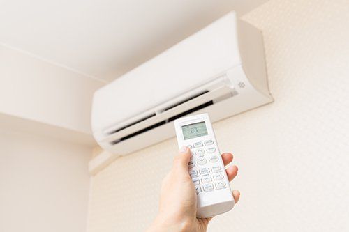 Switching on the Air Conditioner — Fresno, CA — Art Douglas Plumbing Inc.