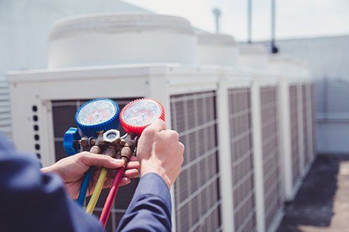 Checking Air Conditioner — Fresno, CA — Art Douglas Plumbing Inc.