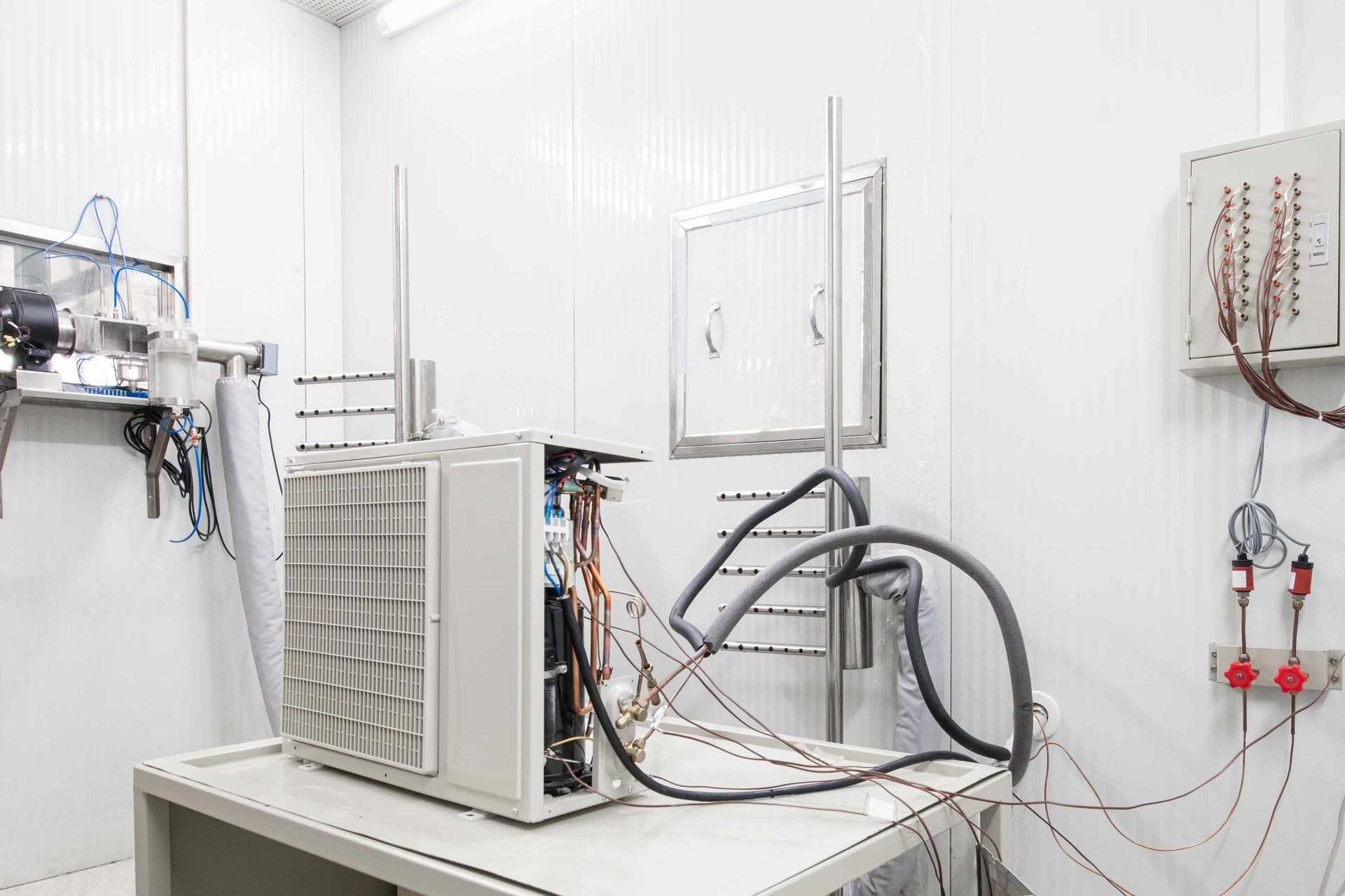 Fixing White Aircon — Fresno, CA — Art Douglas Plumbing Inc. Fixing White Aircon — Fresno, CA — Art Douglas Plumbing Inc.