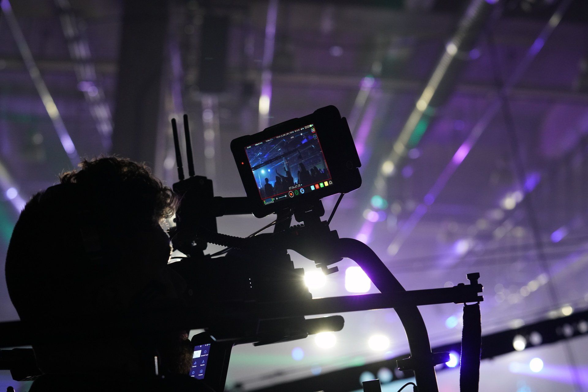 Steadicam operator capturing dynamic event footage during a live corporate production.