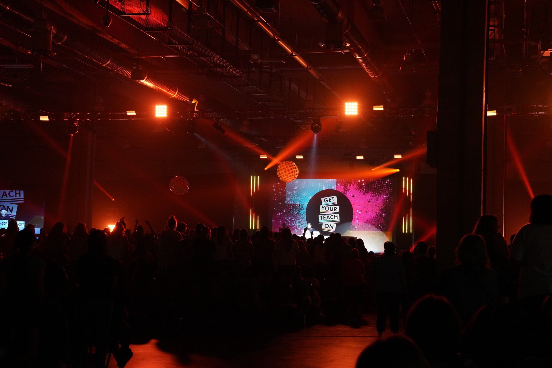 Immersive stage lighting and LED visuals energizing attendees during a corporate event celebration.