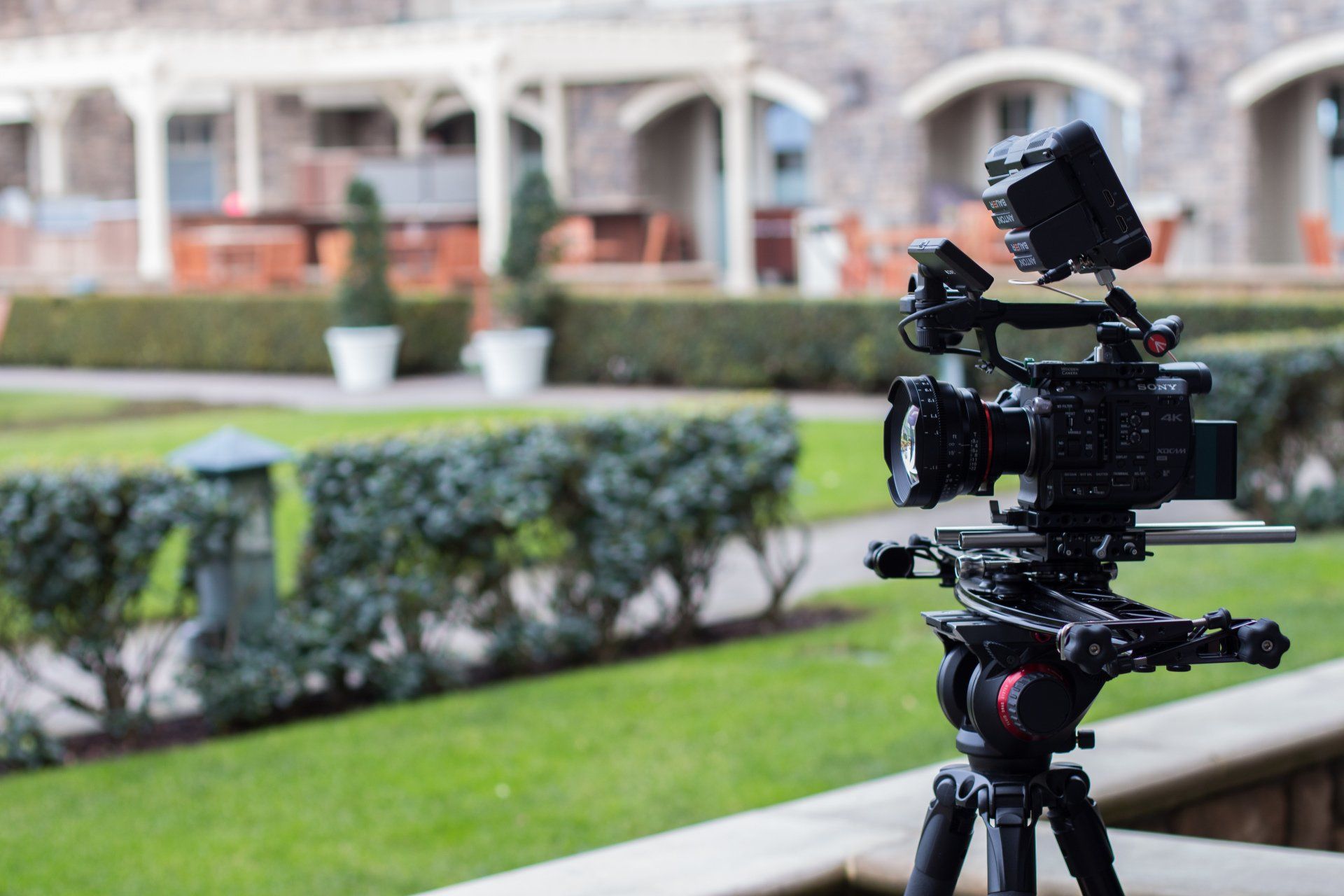 Professional cinema camera prepared for an on-location commercial video shoot outside a corporate venue.