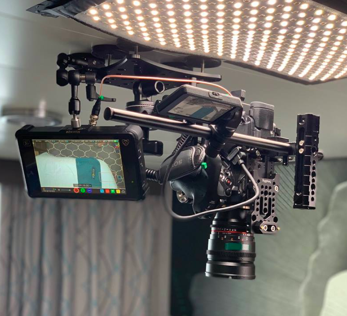 Professional cinema camera and lighting setup prepared for an on-location commercial video production.