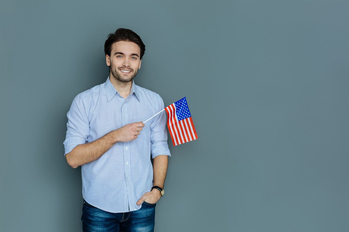 Joyful Man Holding the American Flag — Peekskill, NY — Law Office of Michael J. Segreto Joyful Man Holding the American Flag — Peekskill, NY — Law Office of Michael J. Segreto