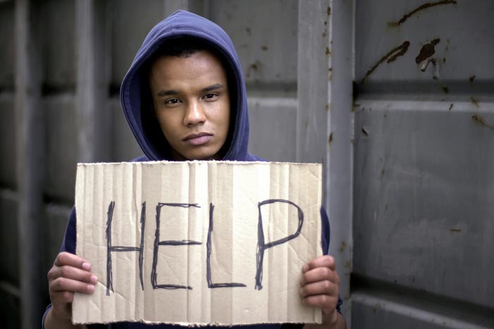 Youth Holding Help Sign — Peekskill, NY — Law Office of Michael J. Segreto Youth Holding Help Sign — Peekskill, NY — Law Office of Michael J. Segreto