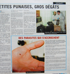 Un journal avec une photo d'une main et la mention