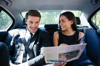 Couple reading the newspaper - aa checker cab in Middlesex County, NJ