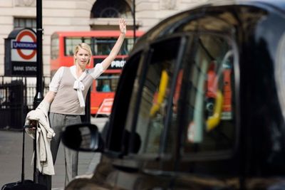 Woman calling a cab - taxi cab in Middlesex County, NJ