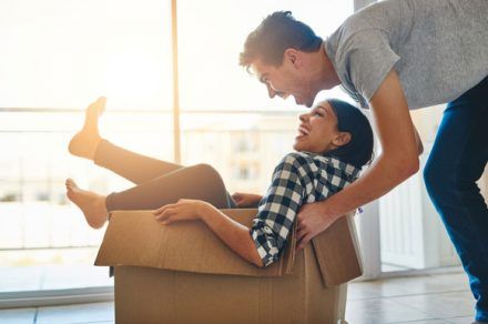 couple playing with moving boxes