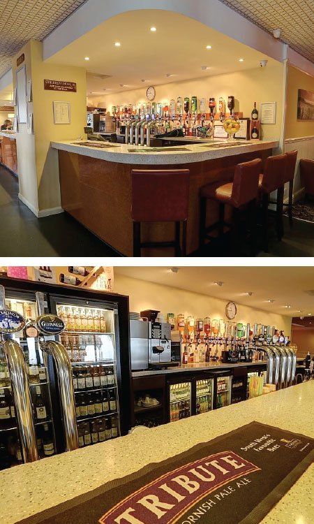 A bar with a tribute bar mat on the counter