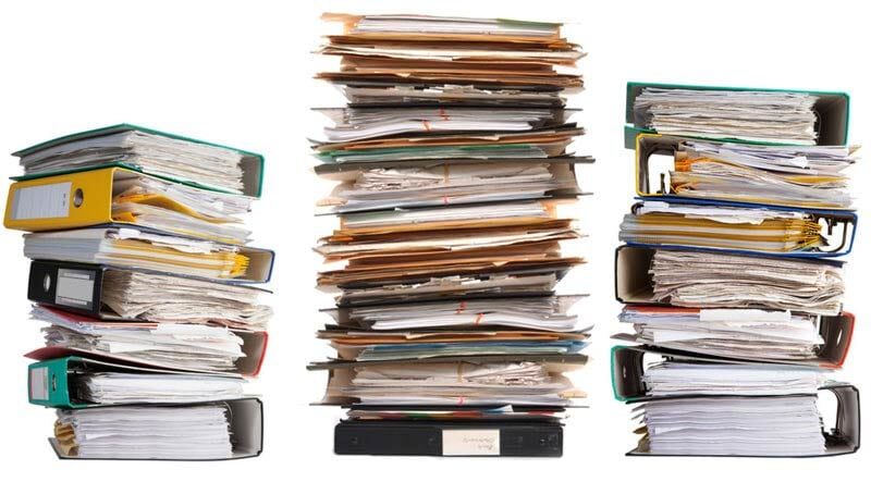 Three stacks of binders are stacked on top of each other on a white background.